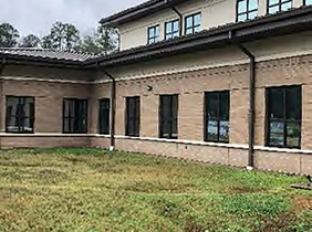 Outside of a building showing windows and gutters