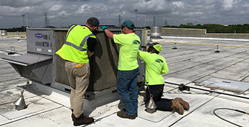 ECM workers using our proprietary HVAC Armor coating.