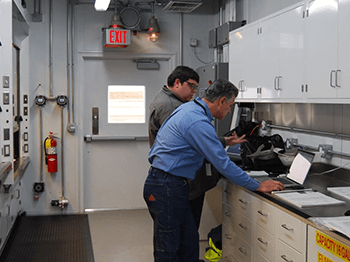 ECM Holding Group employees working at a counter