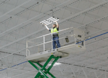 Worker changing out lights